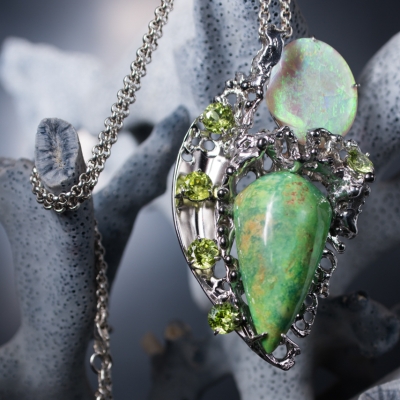 Silver pendant with peridot constellation for the meeting of a turquoise cabochon and Australian opalized shell